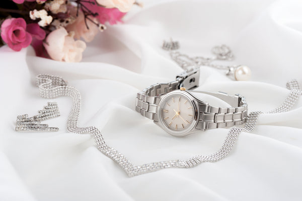 closeup classic woman wristwatch with stainless steel bracelet