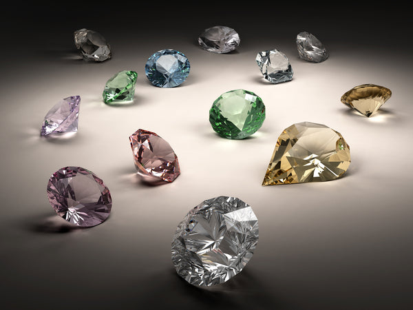 Shiny diamonds in different shapes and colors on dark background