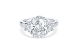 RIVIÈRE PLATINUM THREE-STONE OVAL DIAMOND RING