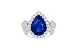 Platinum Three-Stone Pear-Shaped Blue Sapphire and Diamond Halo Engagement Ring