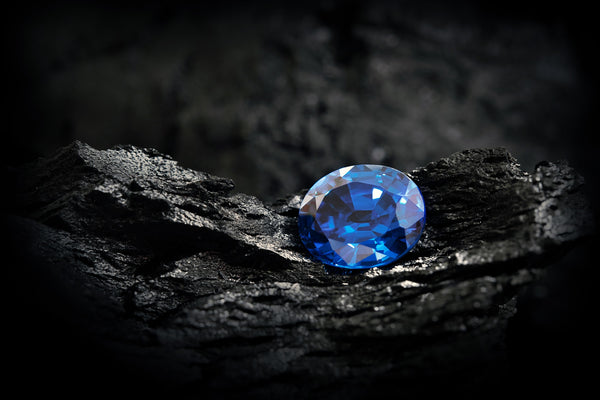 blue sapphire on black coal background