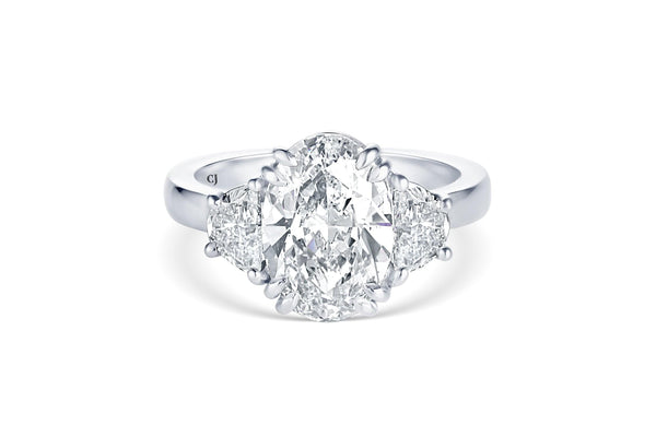 RIVIÈRE PLATINUM THREE-STONE OVAL DIAMOND RING