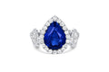 Platinum Three-Stone Pear-Shaped Blue Sapphire and Diamond Halo Engagement Ring