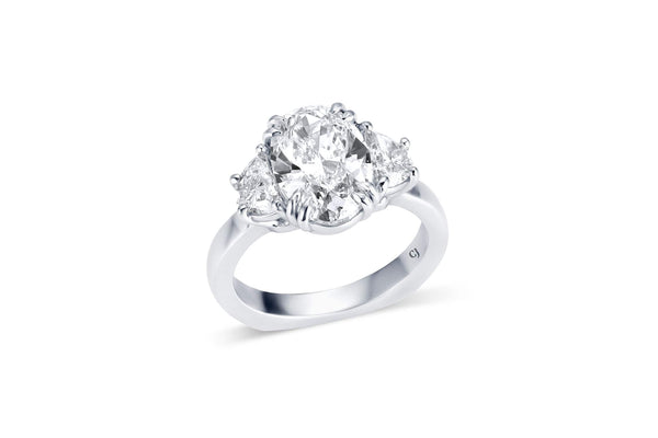 RIVIÈRE PLATINUM THREE-STONE OVAL DIAMOND RING