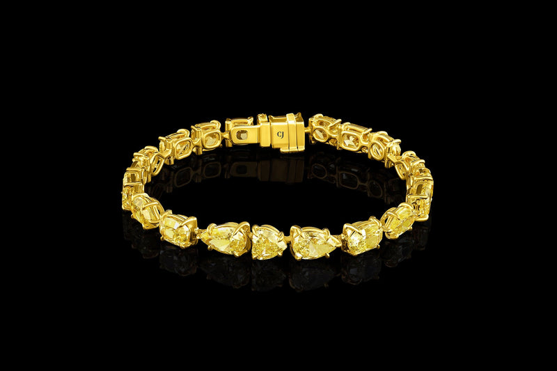 Rivière 18kt Yellow Gold Fancy Intense Yellow Diamond Multi-Shaped Bracelet, GIA Certified